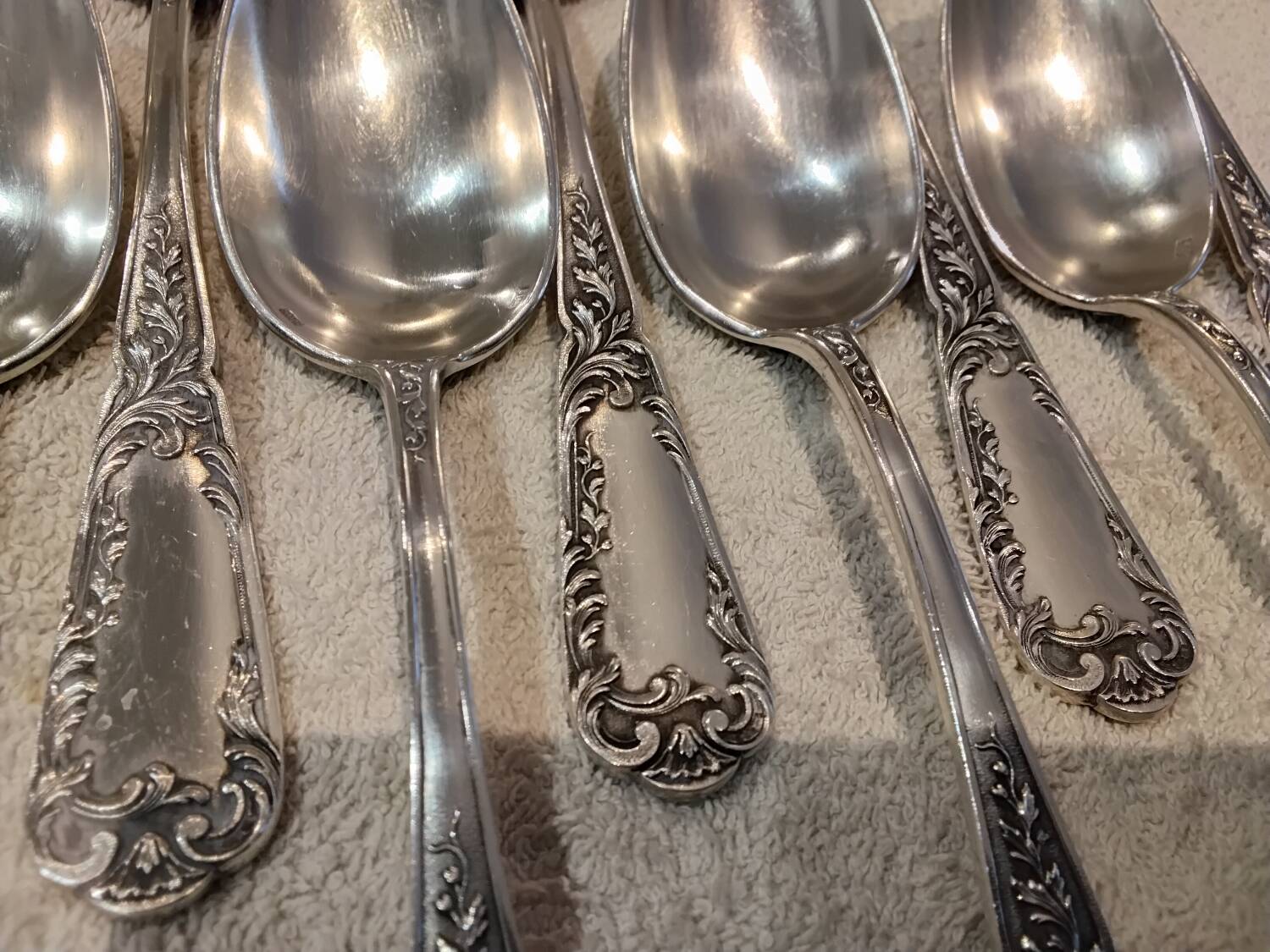 12 silver-plated metal dessert spoons, silversmith SFAM, rocaille design, 19.1 cm.