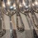 12 silver-plated metal dessert spoons, silversmith SFAM, rocaille design, 19.1 cm.