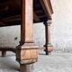 French dining table in Neo-Renaissance style with cross legs.