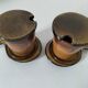 Pair of glazed stoneware cups with saucers and lids