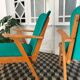 Fauteuil vintage bois et skaï vert