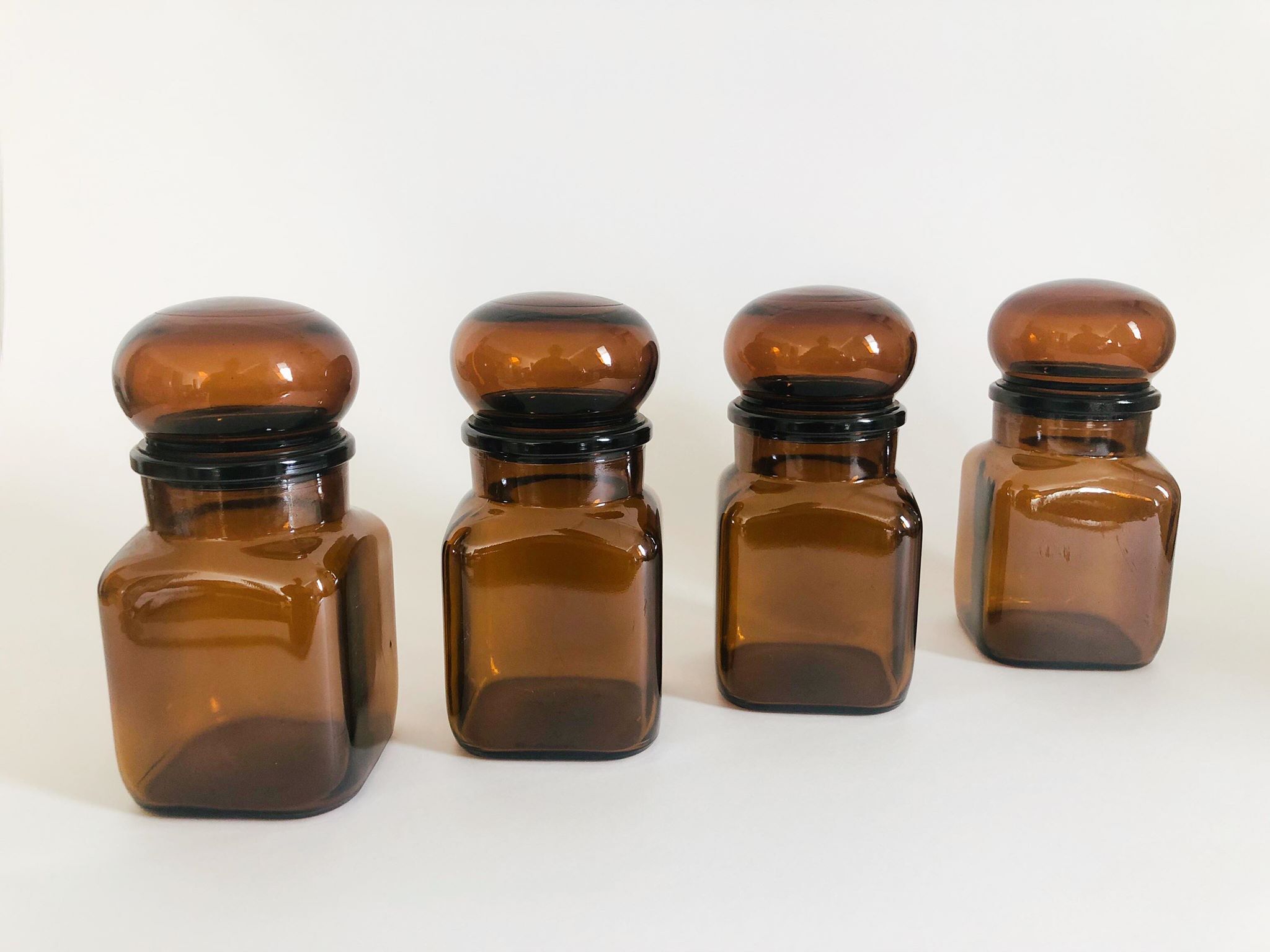 Lot of 4 bottles of amber glass apothecary style