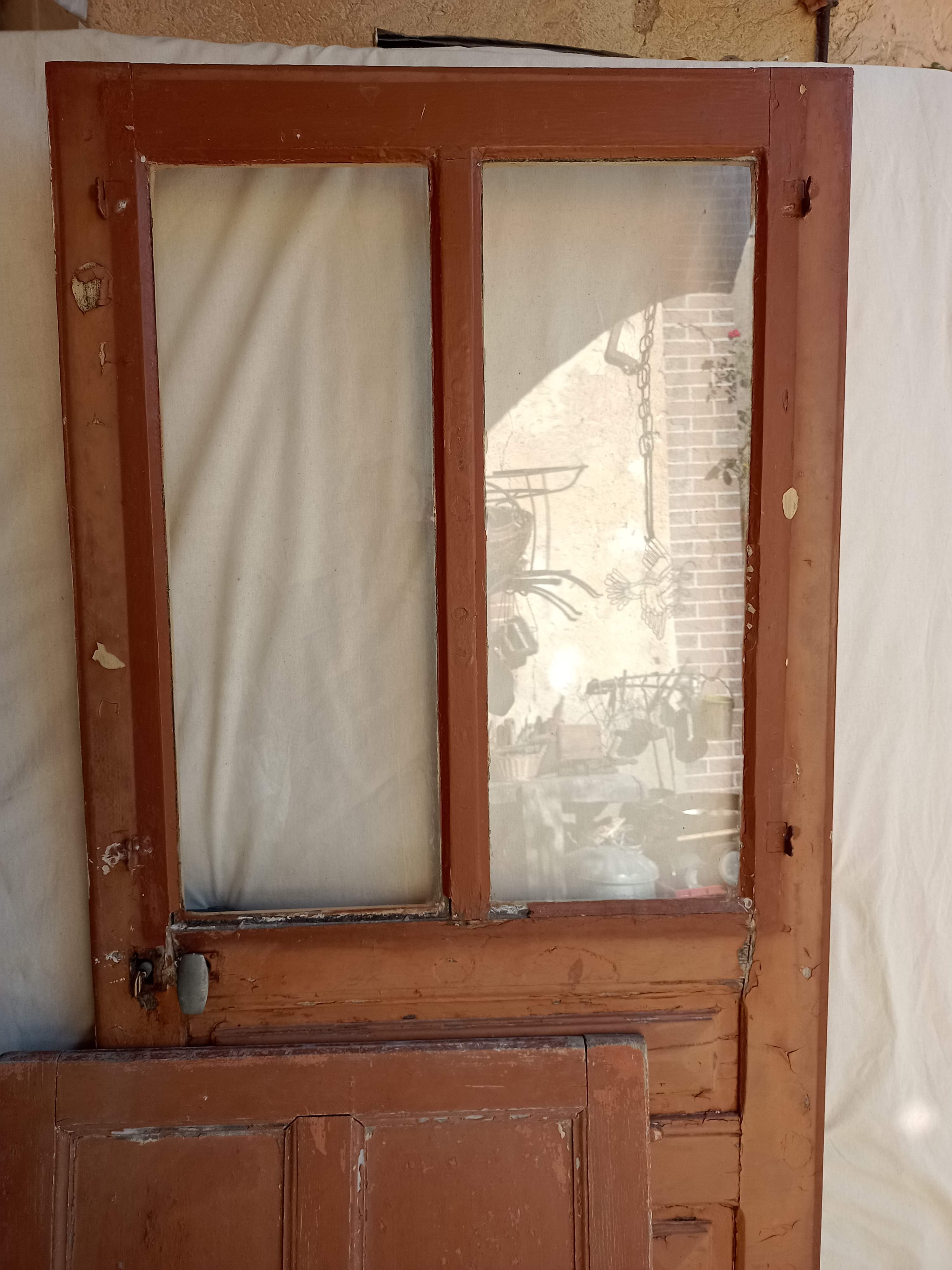Old glazed door with its shutter