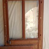 Old glazed door with its shutter