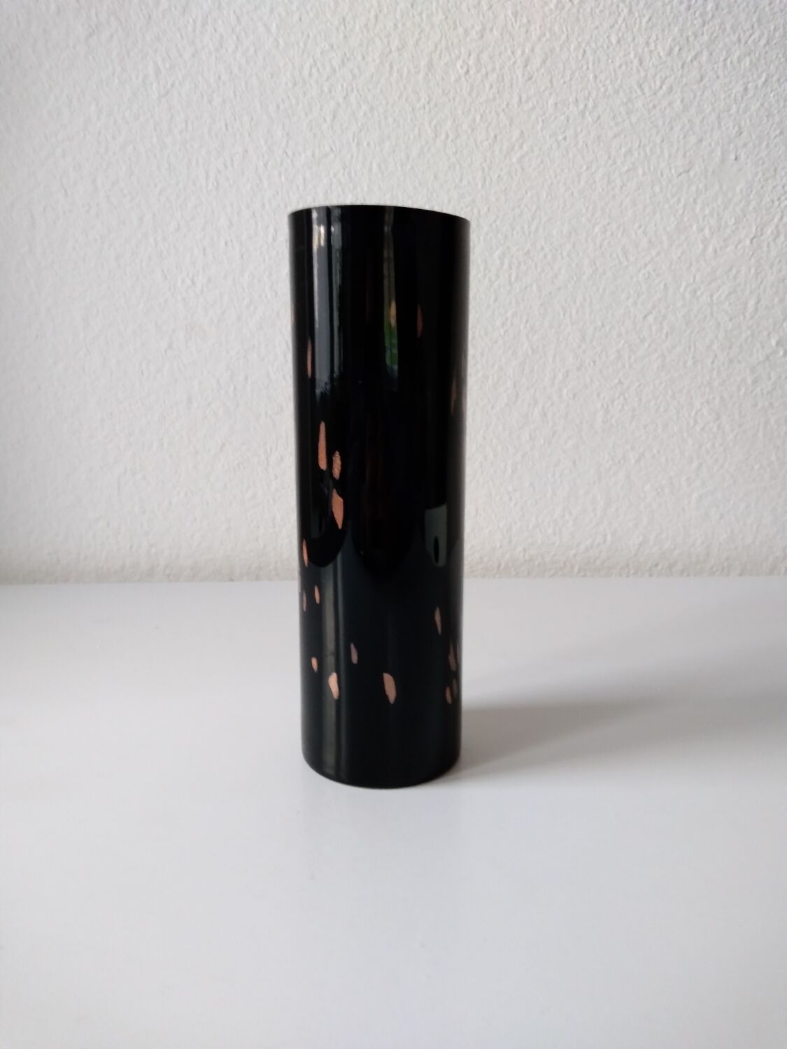 Black opaque glass vase with minimalist style copper inlays