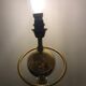 Brass lamp with removable ring around a globe