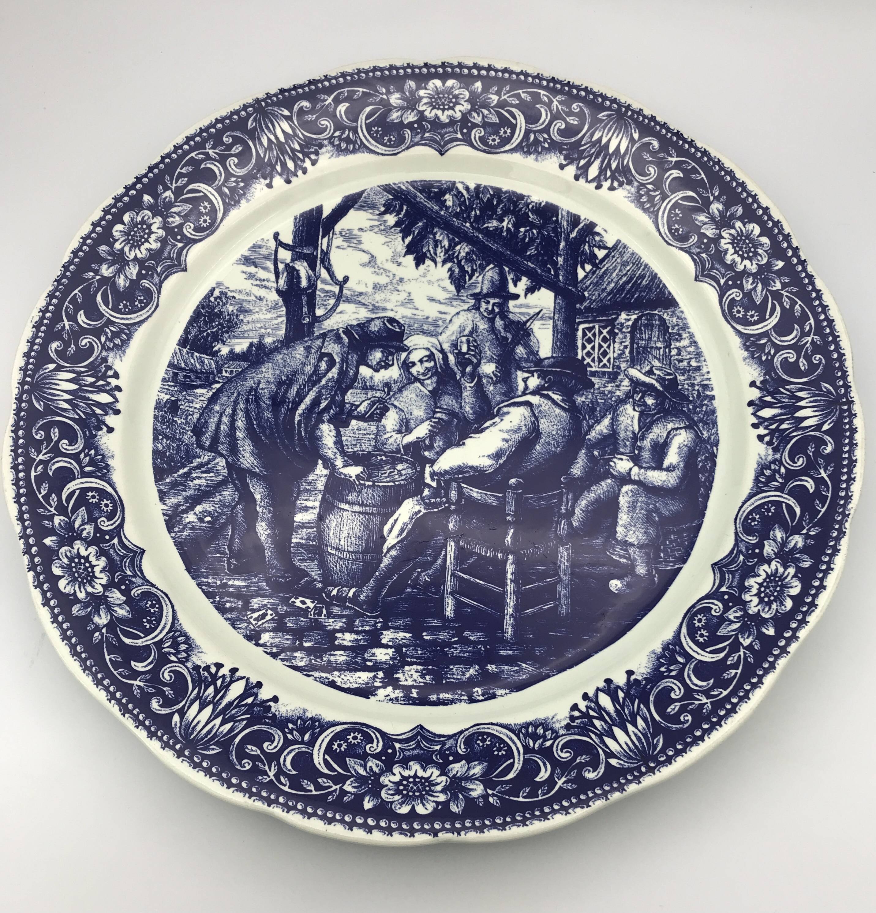 Blue enamelled earthenware wall dish with peasant scene decor Boch La Louvière