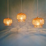 Vintage trio of amber glass pendants, 1960s-70s.