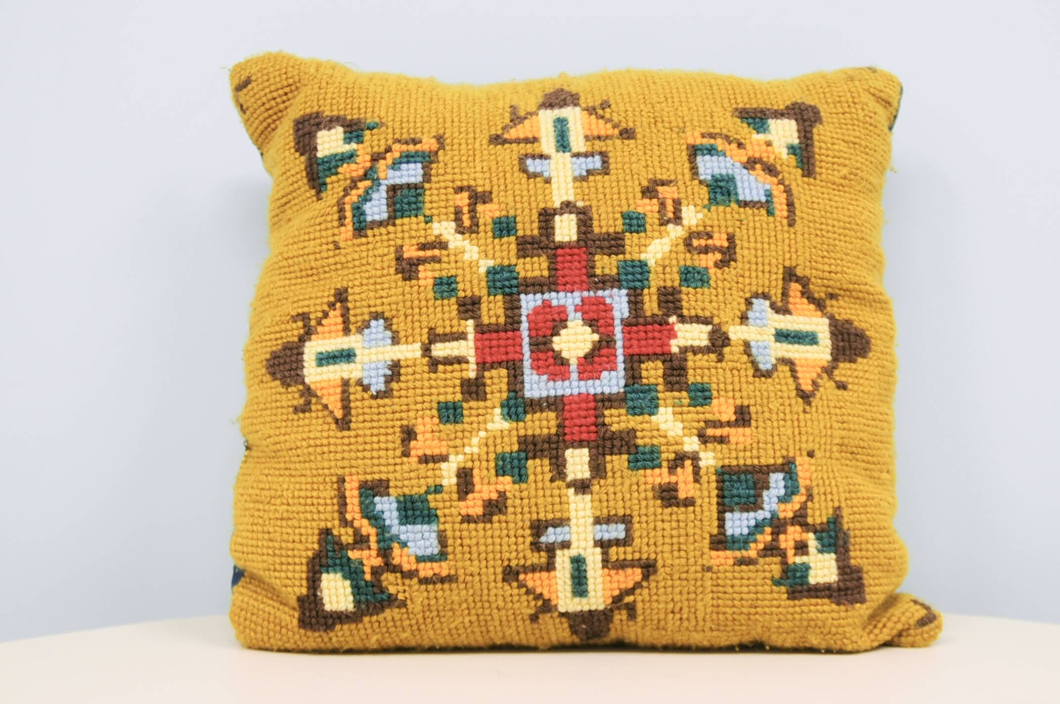 vintage ochre embroidered cushion