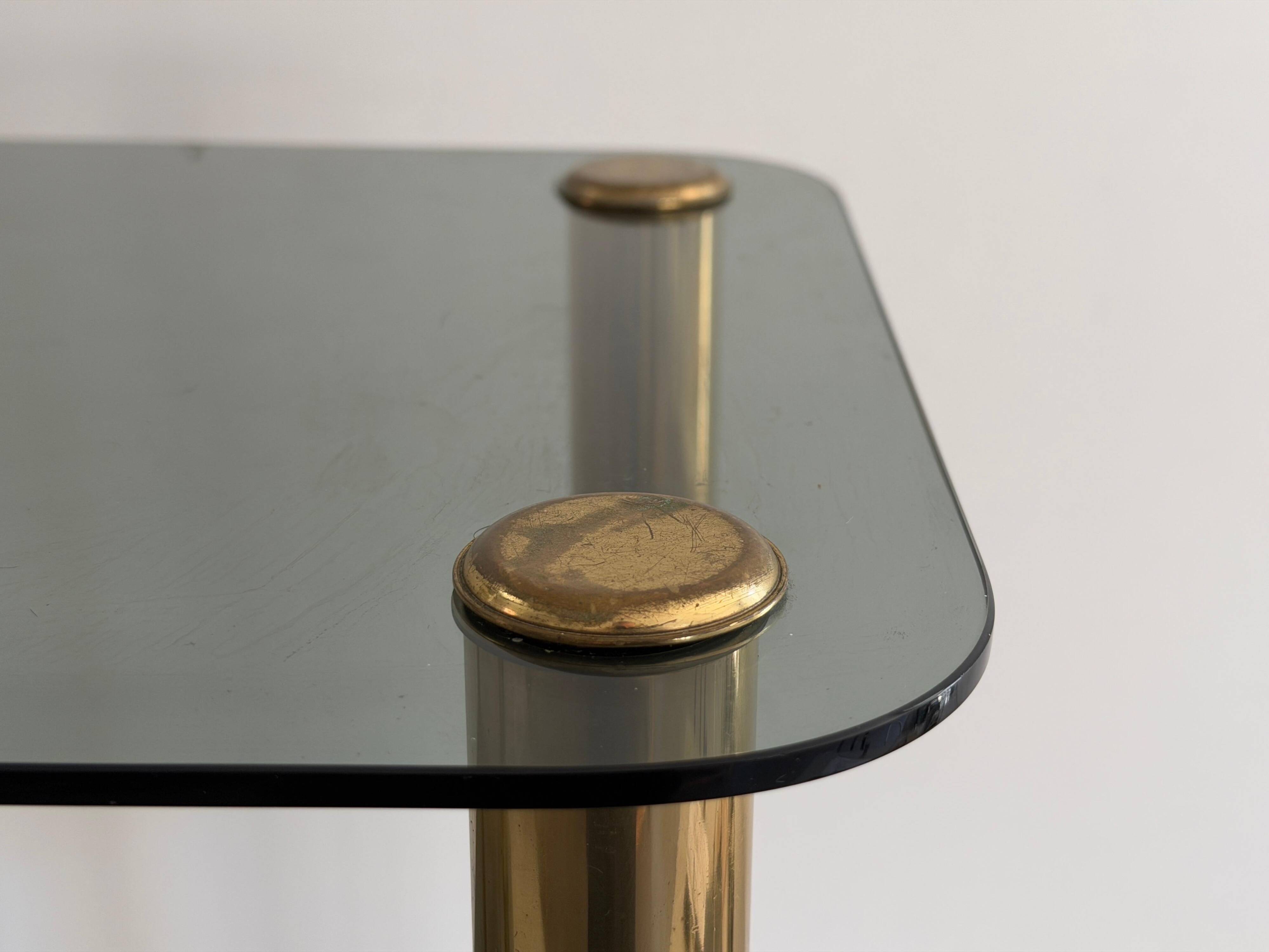 Side table in thick greenish glass with brass legs, Italy, 1960s.