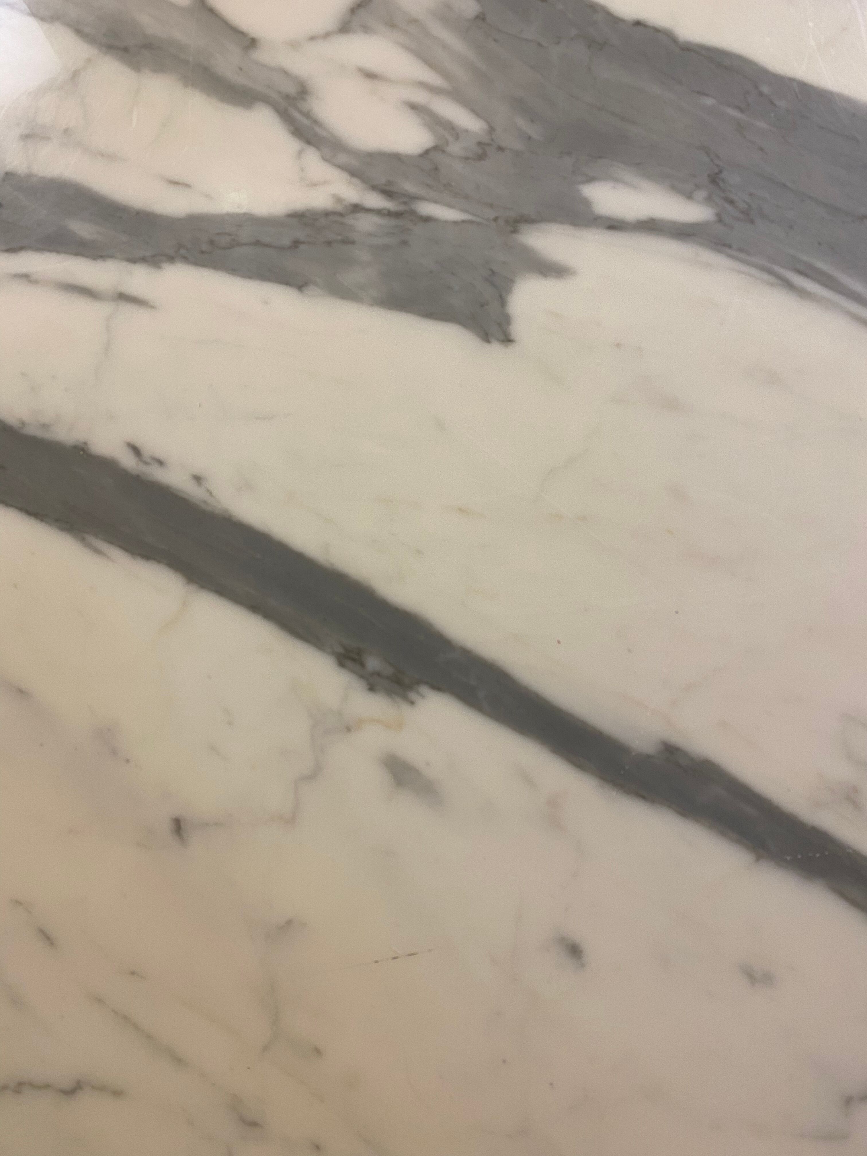 Oval marble dining table with iron base