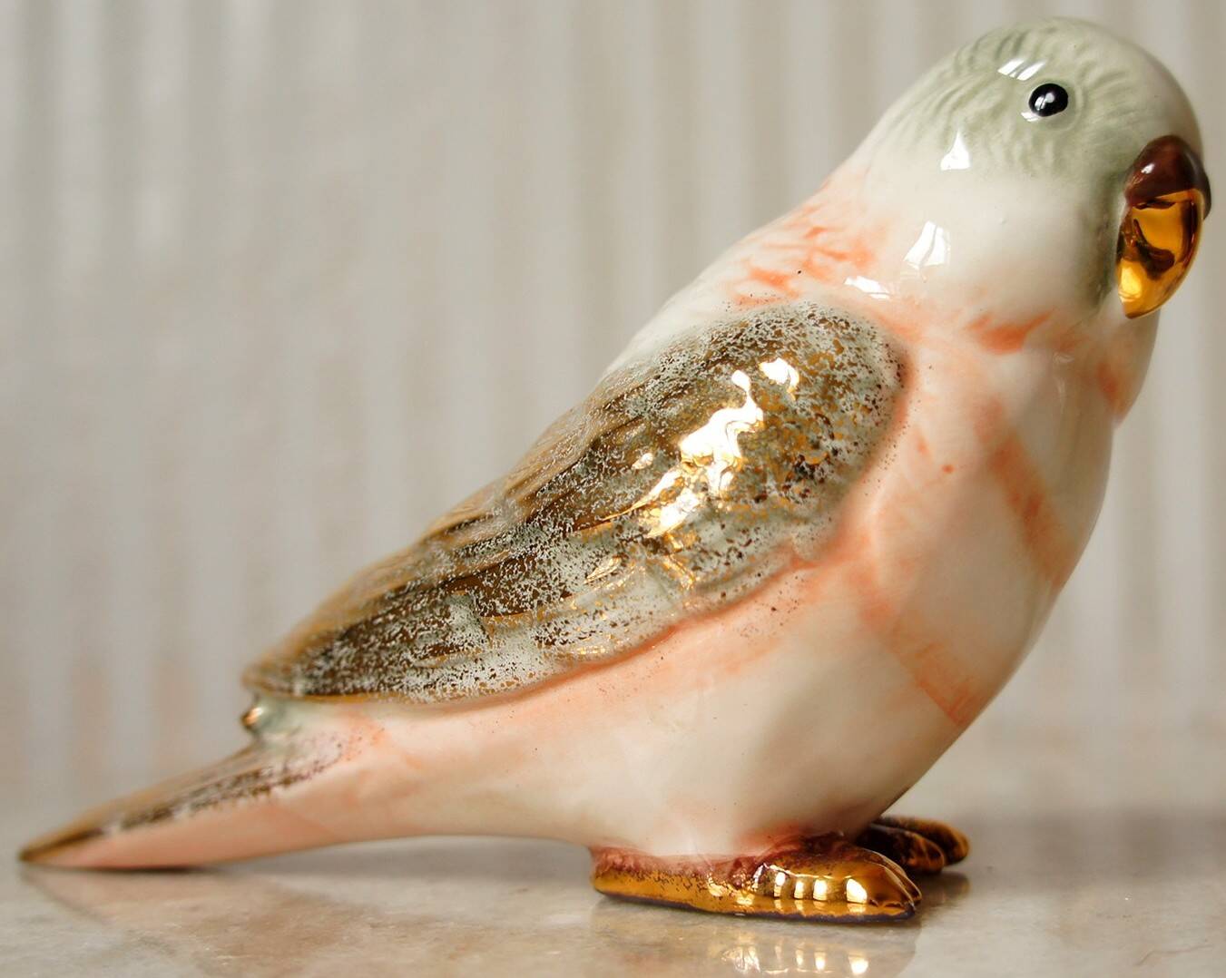 Polychrome & gold ceramic parakeet