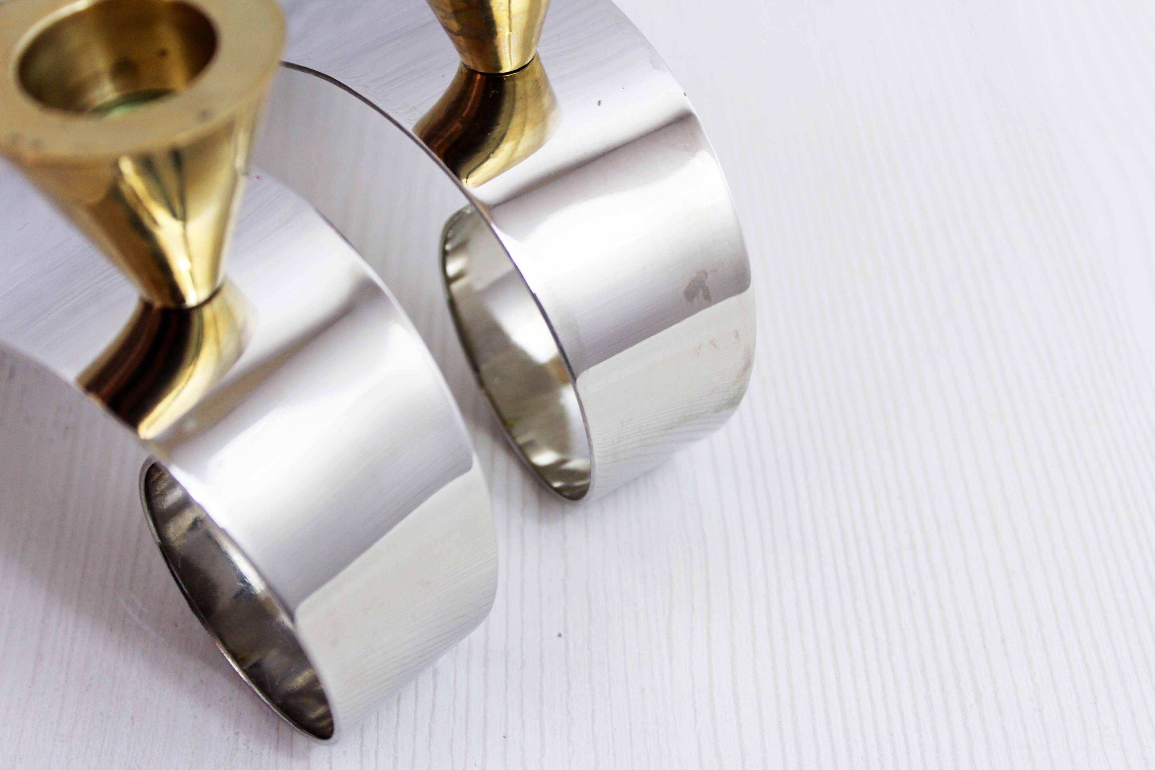 Pair of brass and chrome-plated metal candlesticks