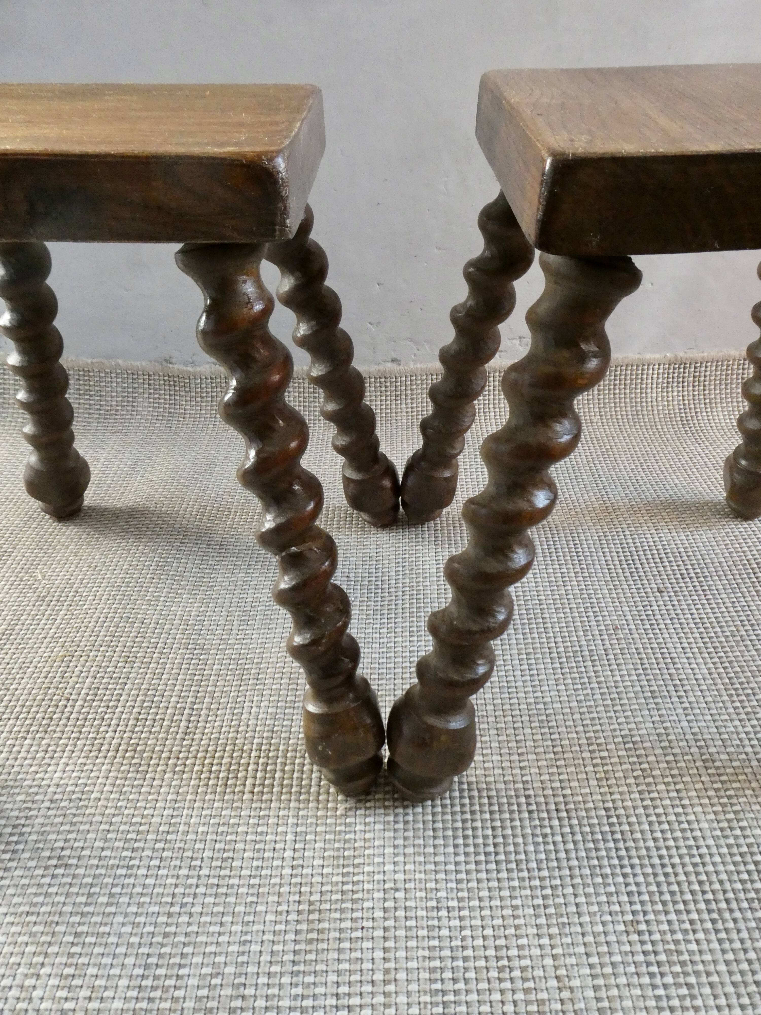 Pair of solid wood stools, carved legs