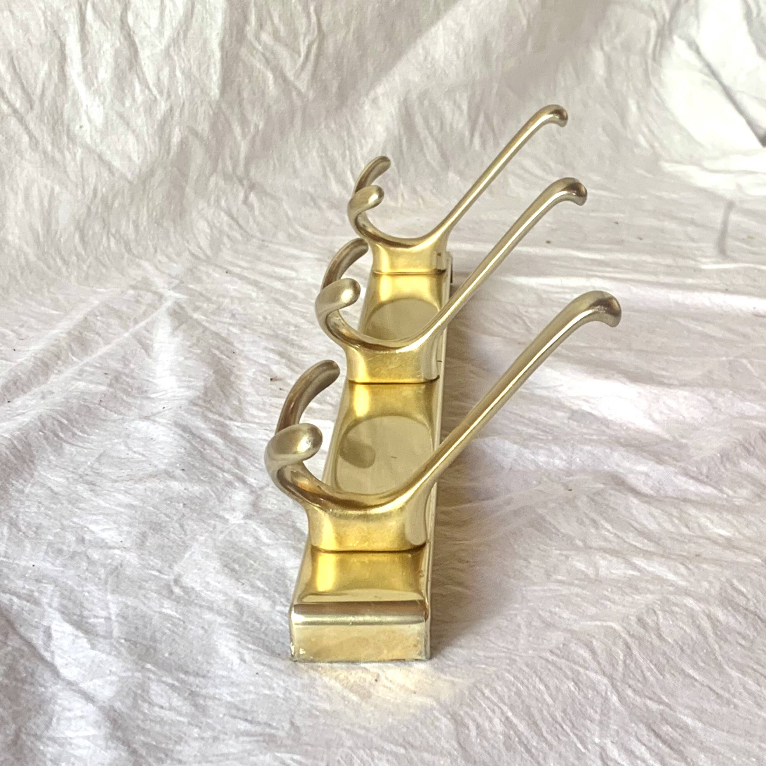 Vintage gold aluminum coat rack with three hooks