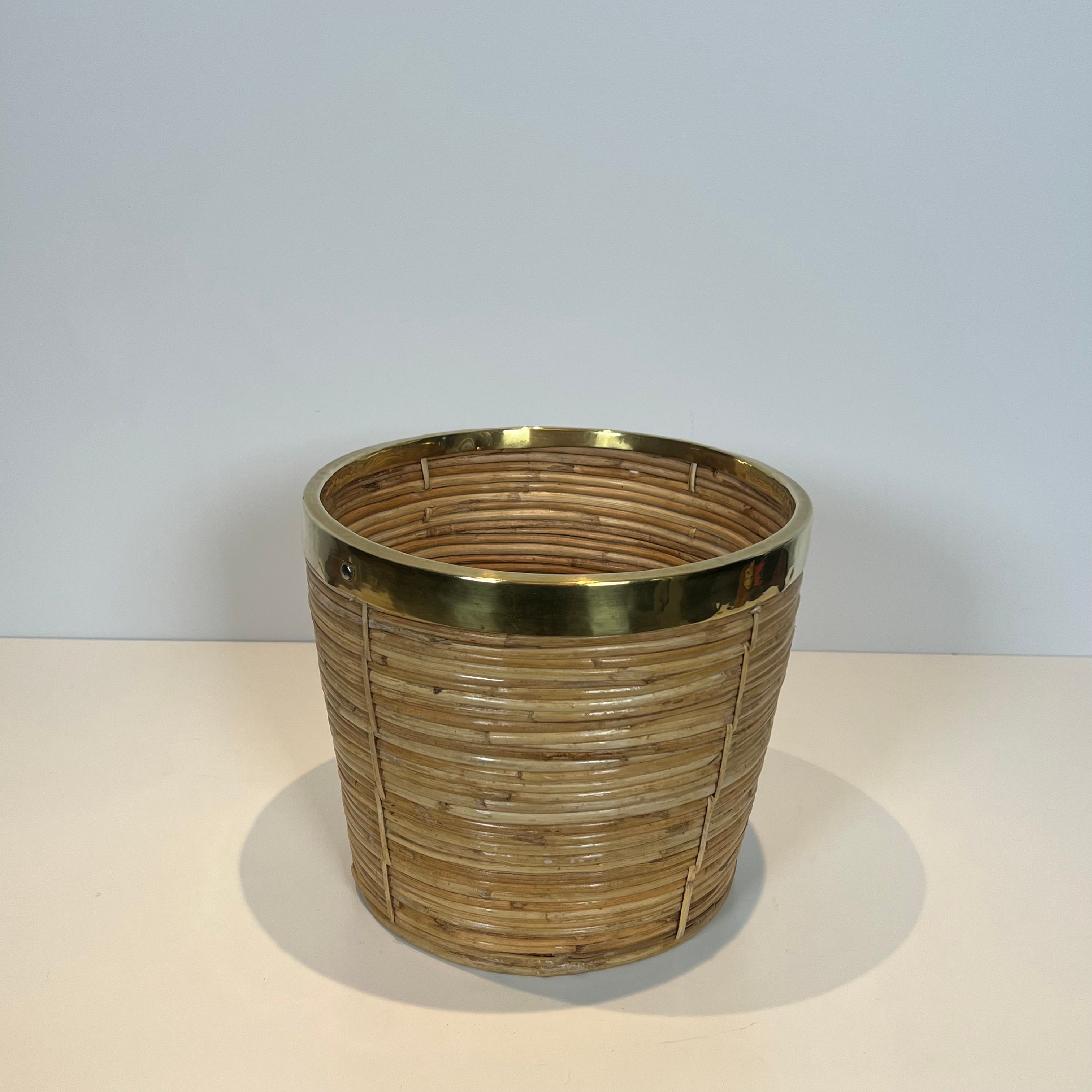 Rattan and brass wastepaper basket in the style of Gabriela Crespi.