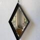 Miroir brutaliste losange en fer