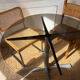 Dining table in metal and smoked glass Roche Bobois