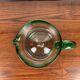 Vintage blown glass jug, green border
