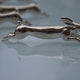 12 silver-plated metal "rabbit" knife rests