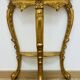 Golden console in Louis XV Rococo style made of resin.