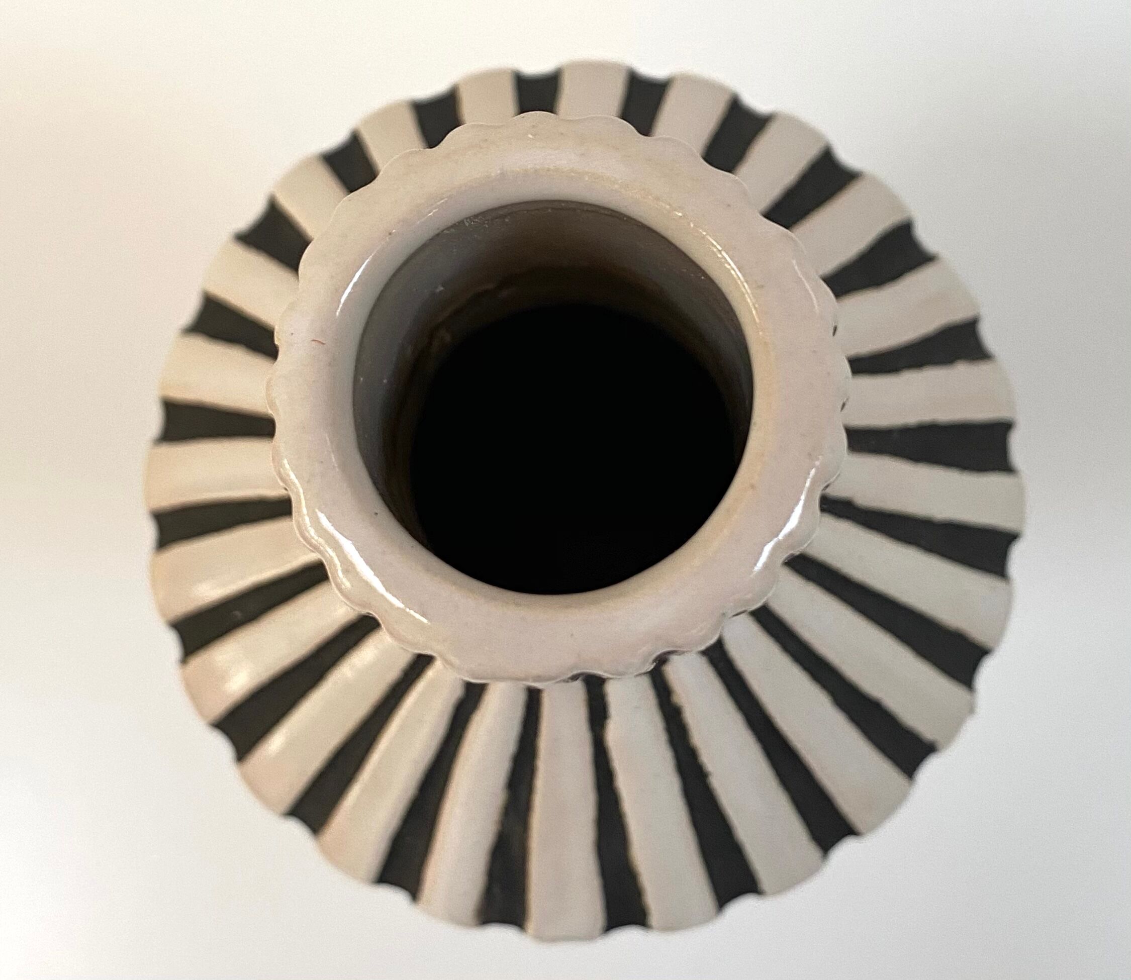 Graphic ceramic vase with black and white stripes