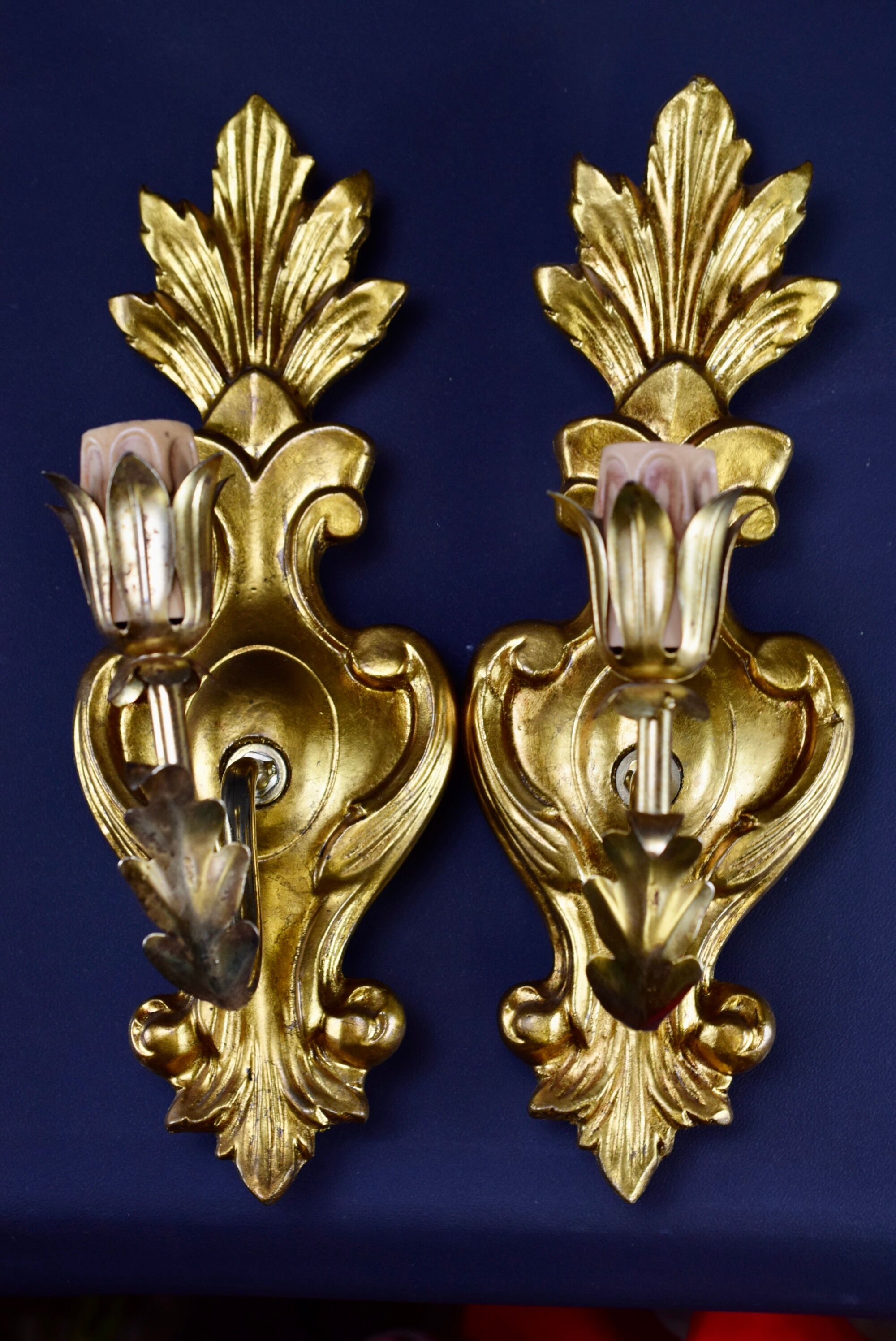 Pair of walled carved wood wall lamps