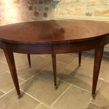 Solid oak table with 3 extension cords, 6 oak chairs with straw seat