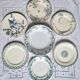 Old mismatched flat plates in iron earth earthenware accompanied by a dish