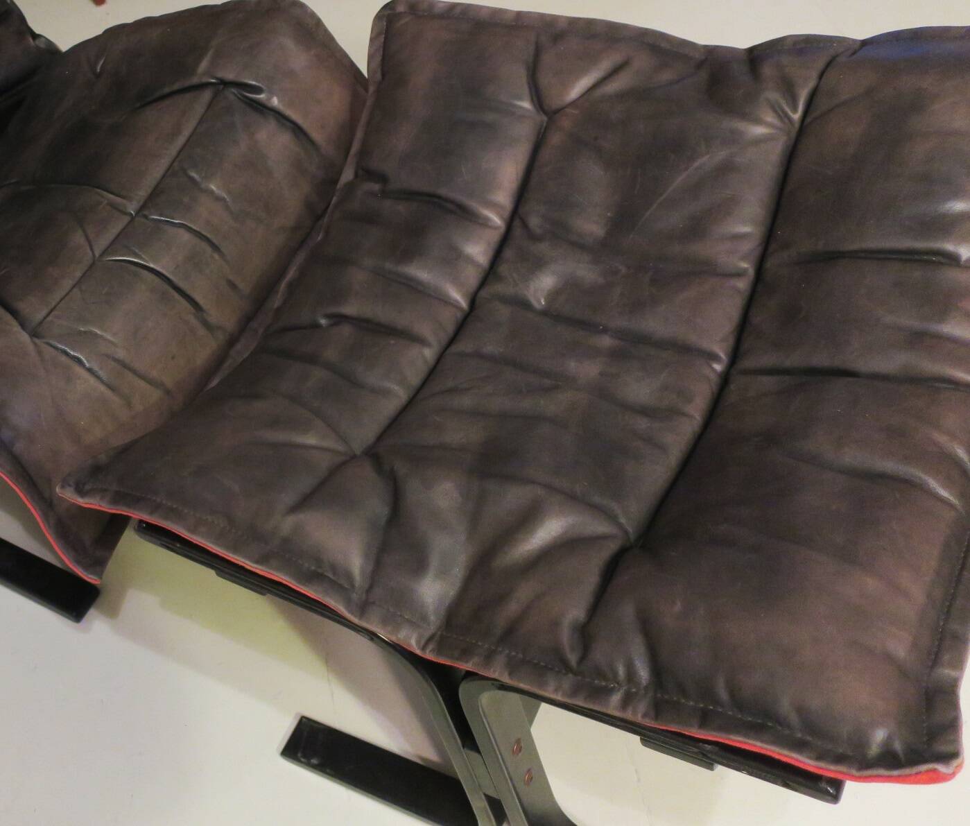 Ingmar Relling patinated leather lounge chair with ottoman, Norway 1960s