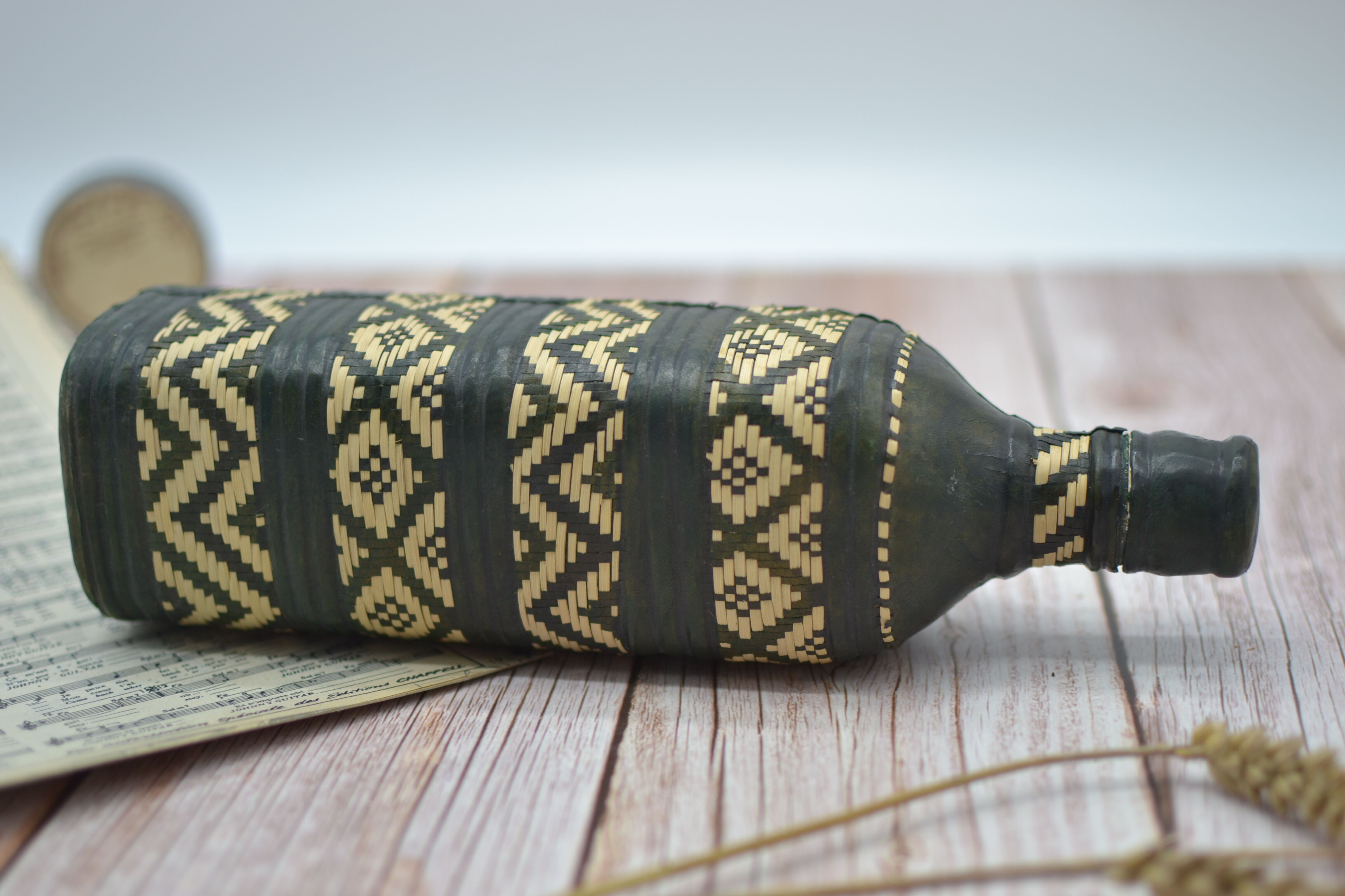 Set of 2 decorative vintage bottles covered with leather & wicker