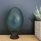 Emu egg naturally green / blue on dark wood bases