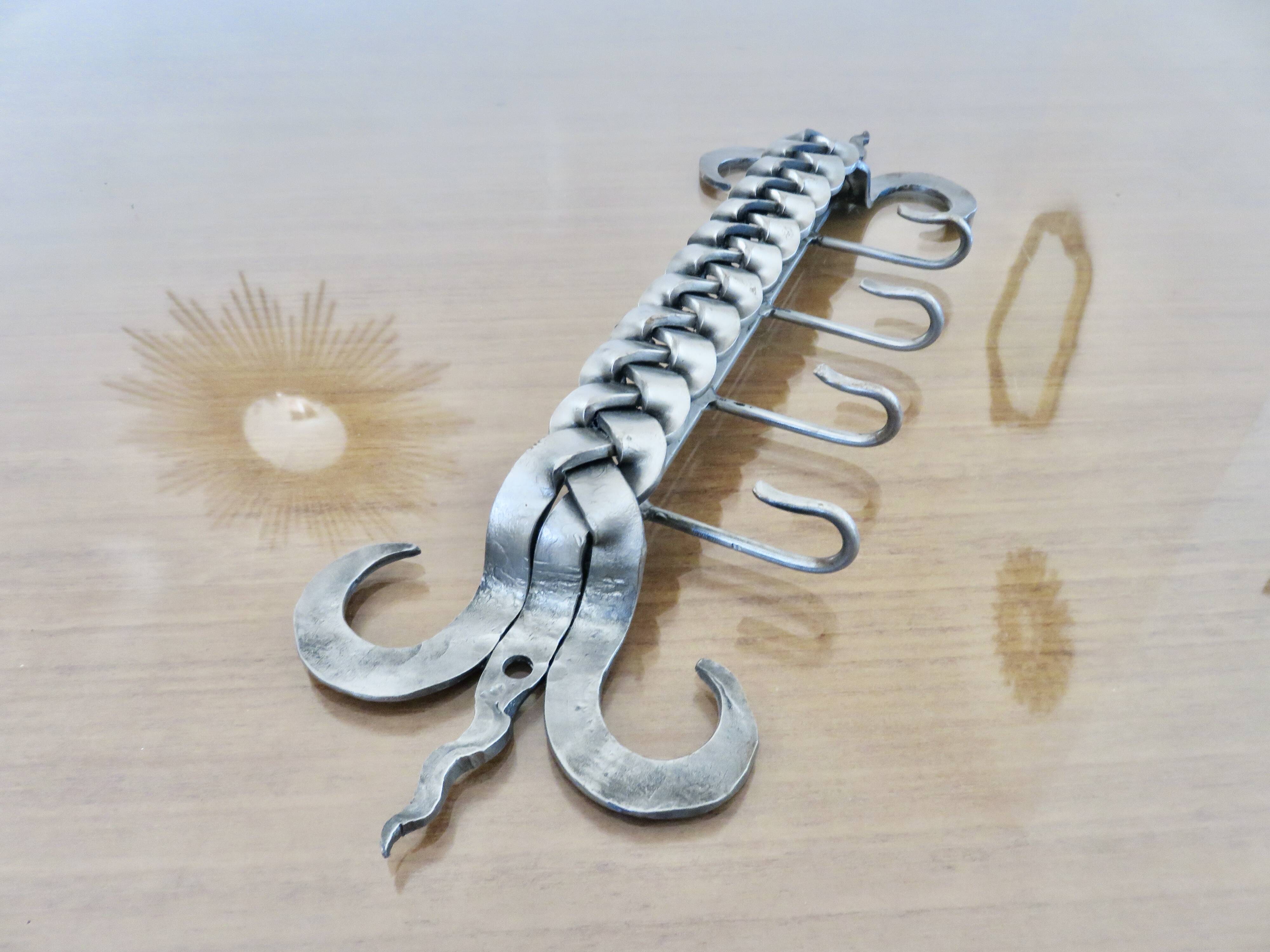 2 Tea towel holders, ironwork in braided raw steel, 1970