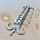 2 Tea towel holders, ironwork in braided raw steel, 1970