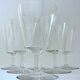 Suite of six art-deco glasses with red wine in modernist shape in cut crystal