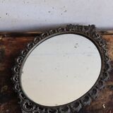 Baroque style oval metal mirror