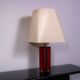 Red metal sculptural table lamp with oversized lamp shade circa 1980