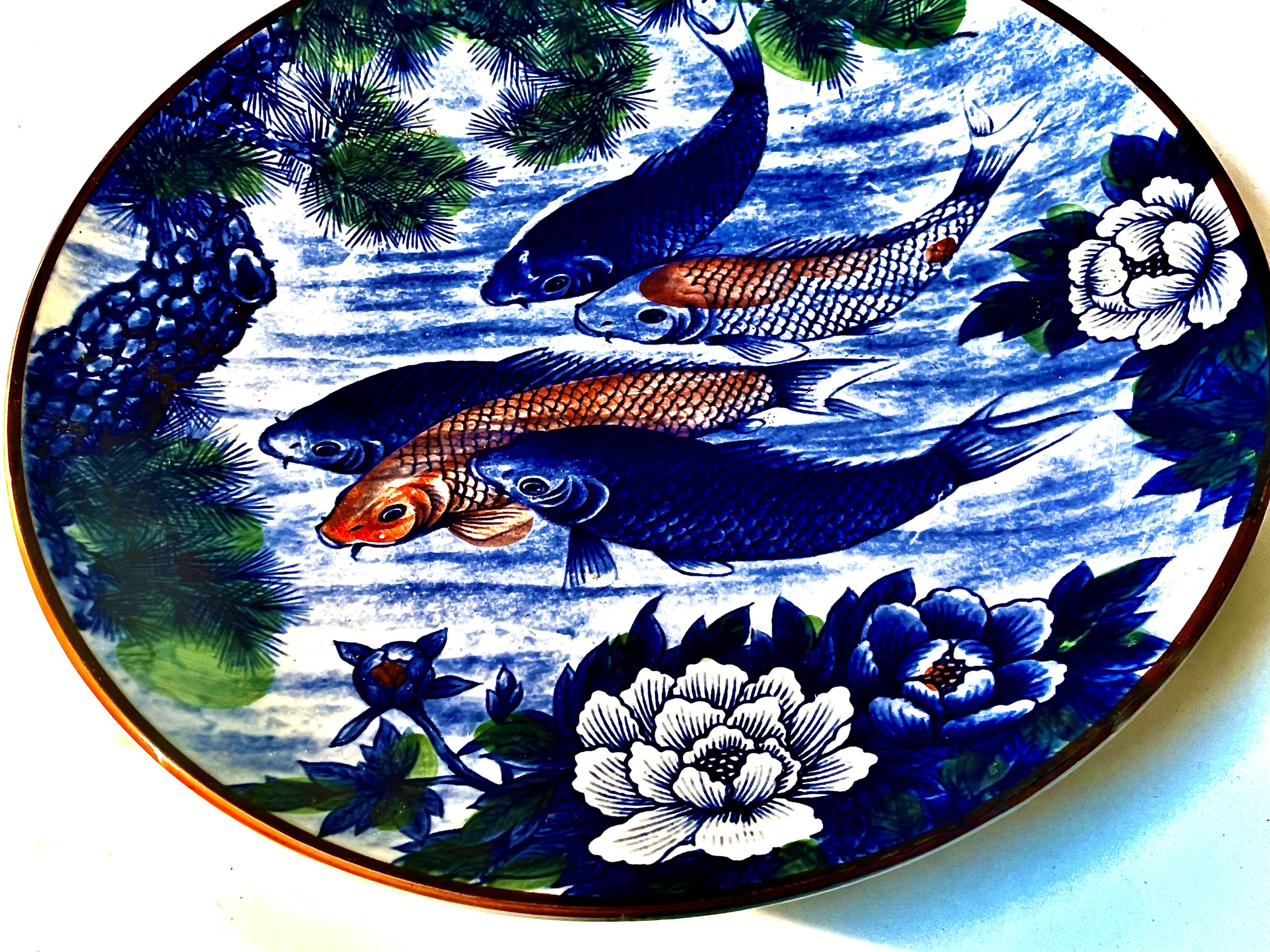 Decorative porcelain plate featuring a koi carp.