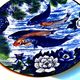 Decorative porcelain plate featuring a koi carp.