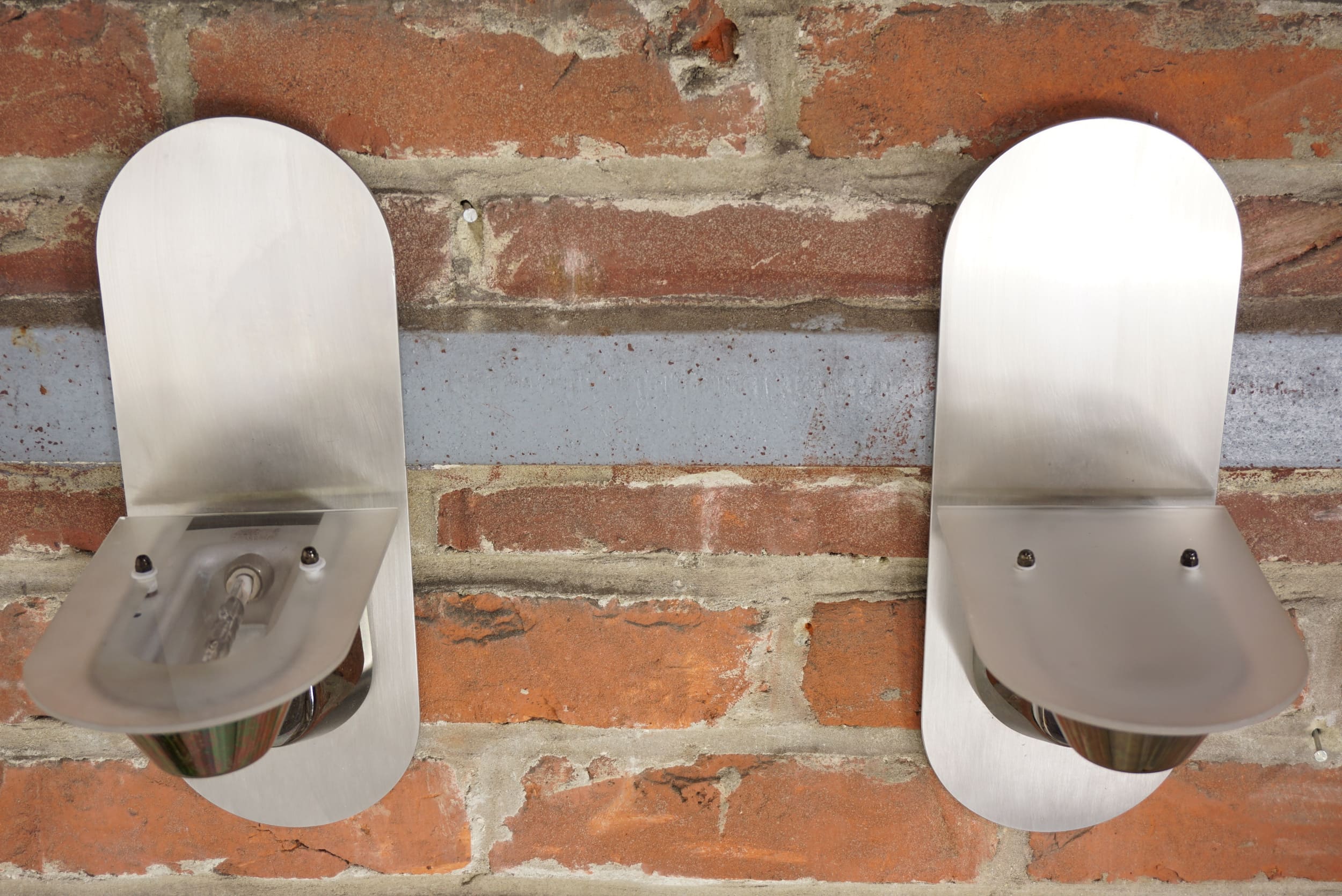 Pair of stainless steel and glass wall lamps