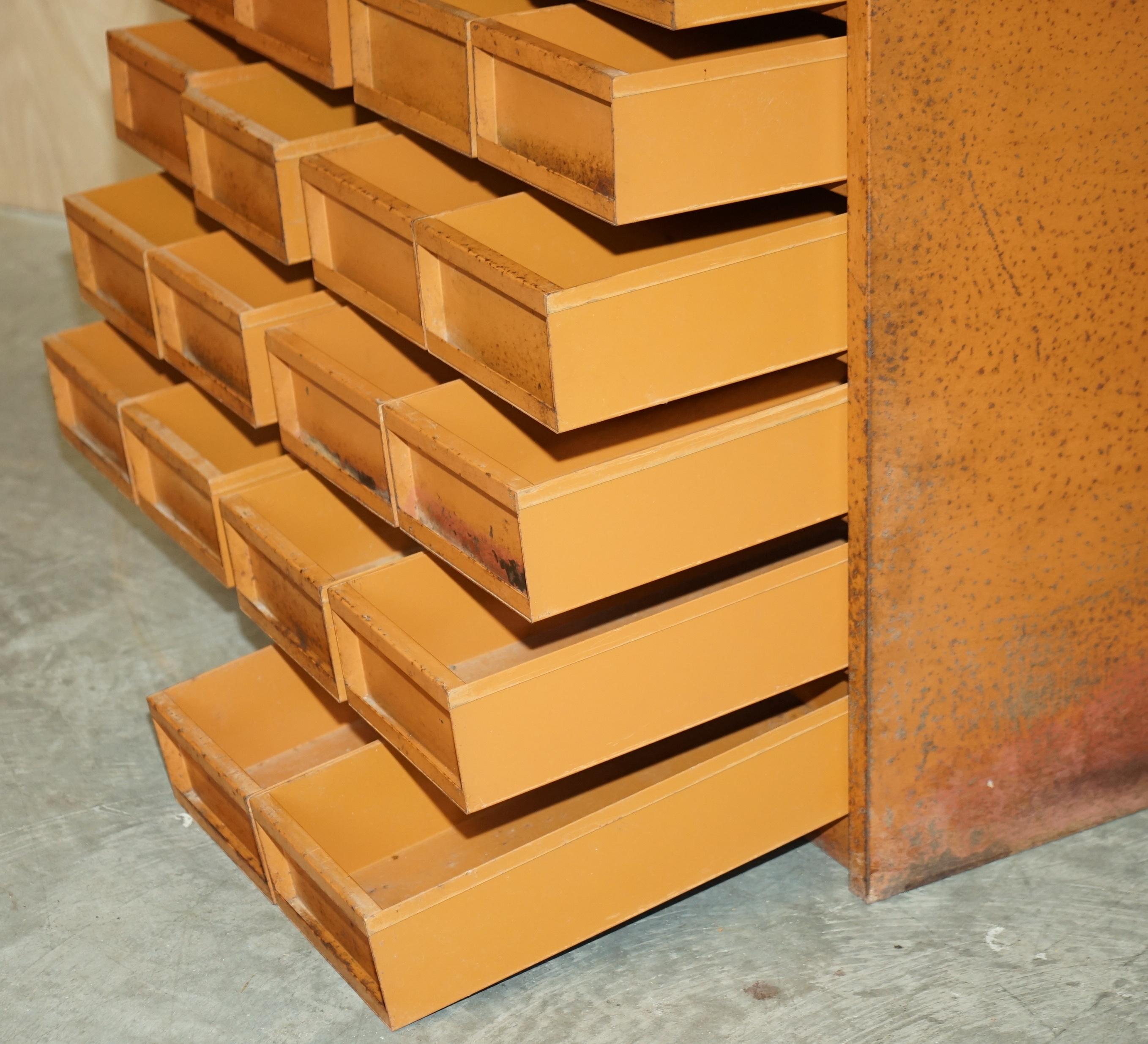 Industrial metal chest of drawers with 30 drawers.