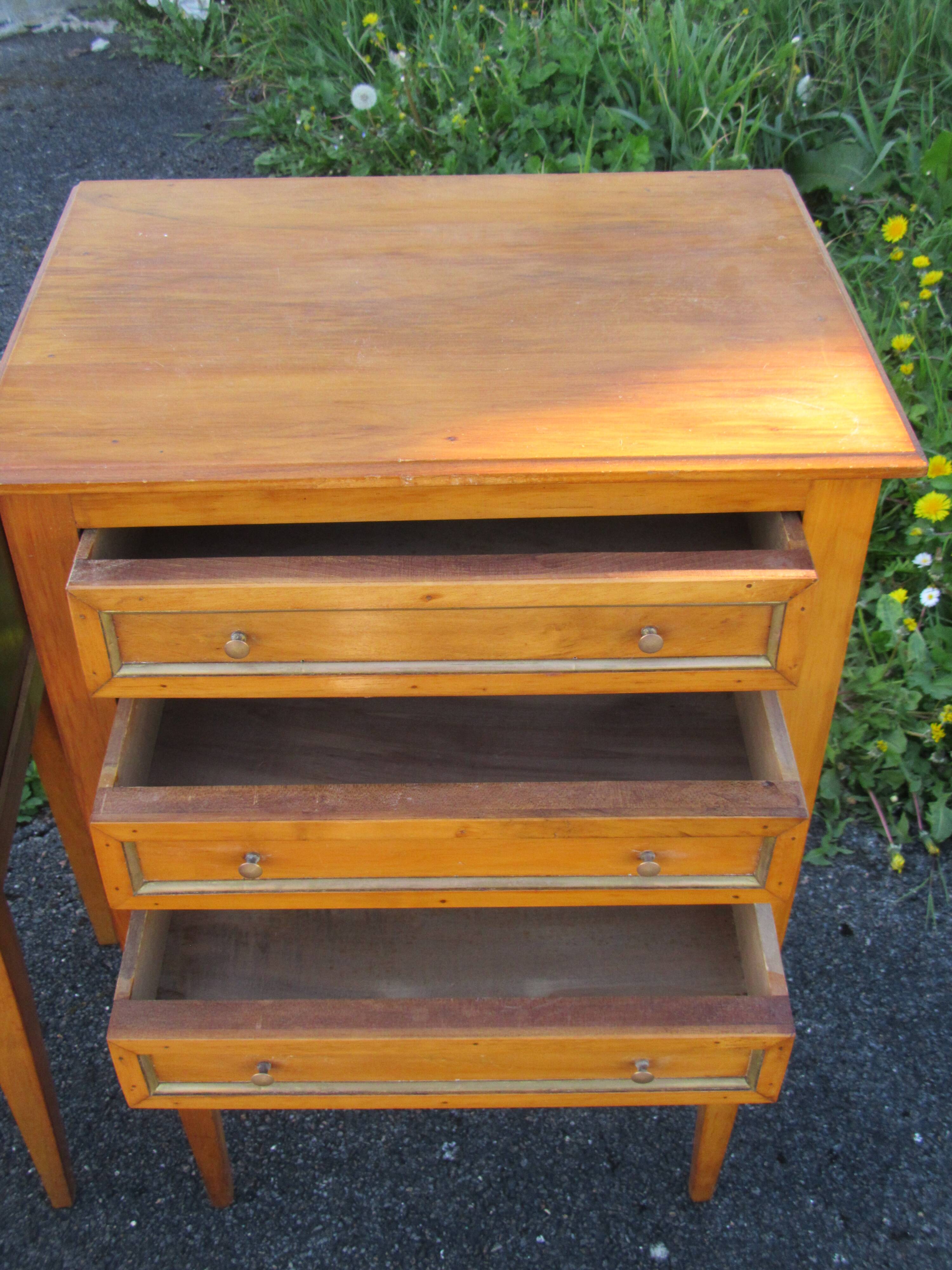 Pair of walnut bedside tables in Louis XVI style with brass inlay.