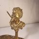 An antique bronze cigar lighter.