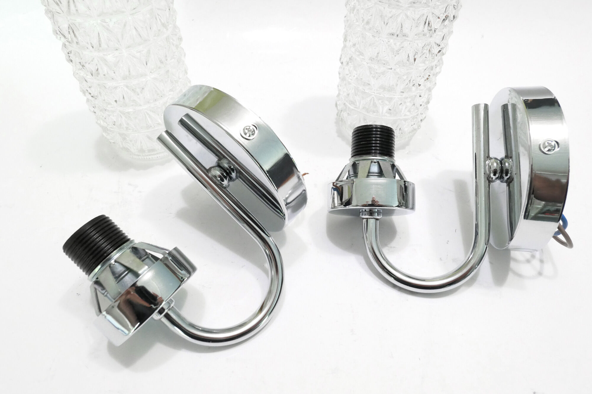 Pair of 1970 chrome metal wall light and molded glass globes.