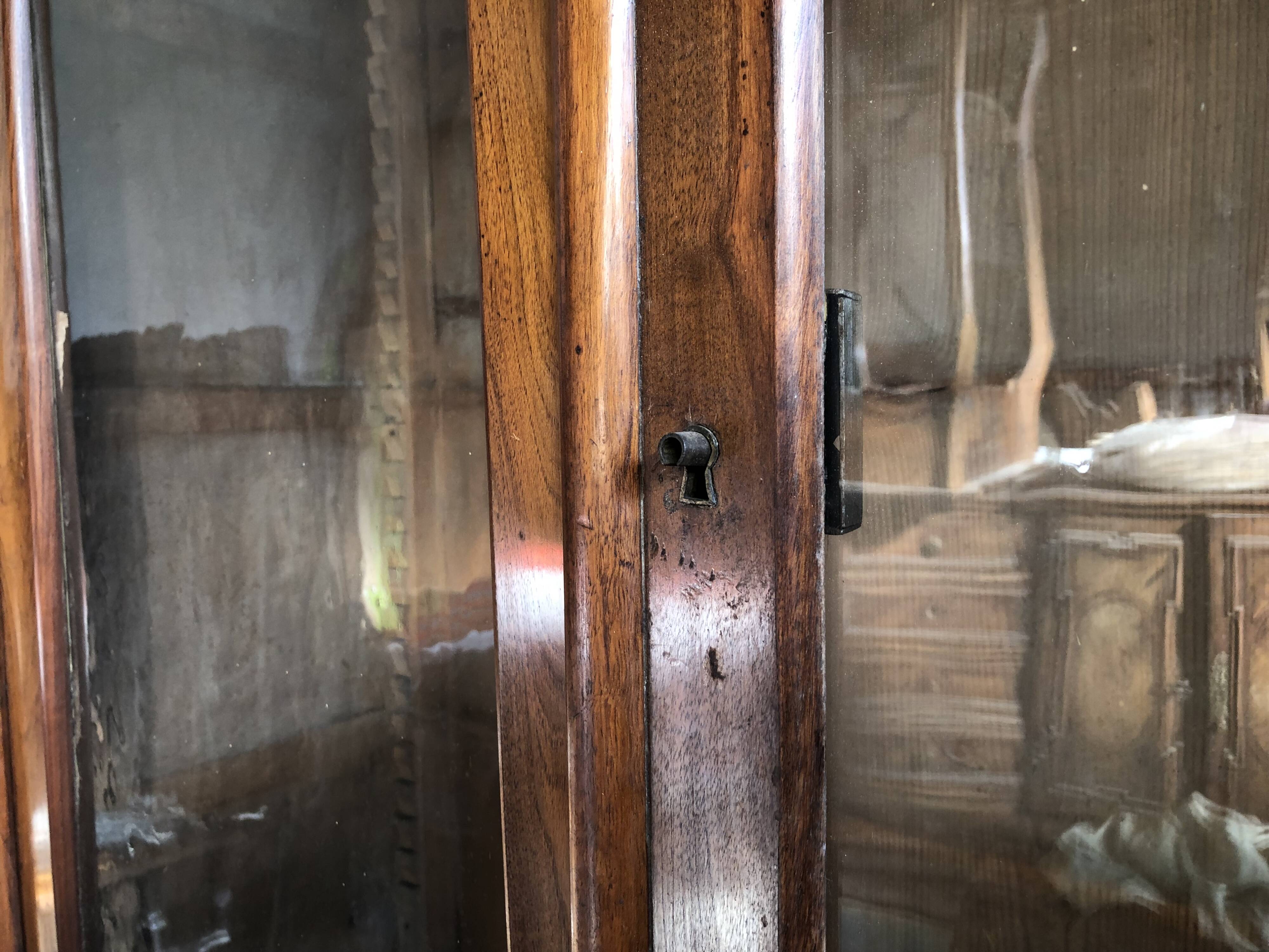 Louis Philippe two-body bookcase in walnut wood.