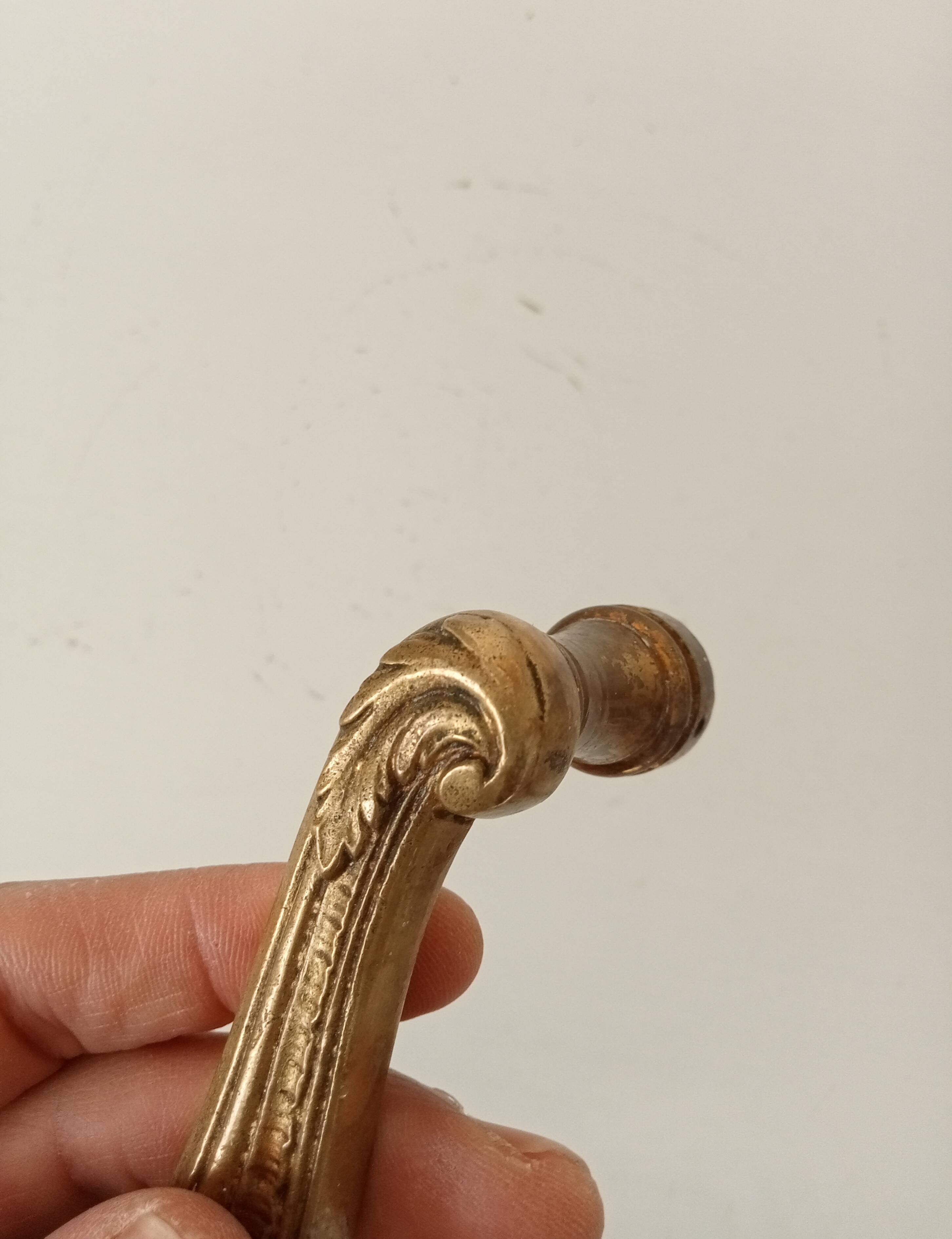 Antique bronze door handle in Empire style