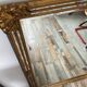 Large Deknudt mirror in gilded wood and glazing beads