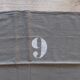 10 numbered khaki tea towels