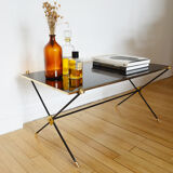 Black glass and brass coffee table in the 1960s