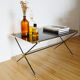 Black glass and brass coffee table in the 1960s